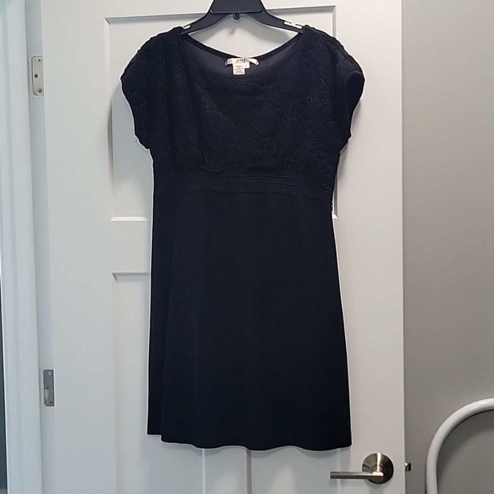 Black cocktail dress with high waistline and crochet top.